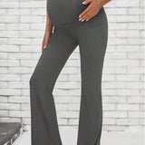 Leggings acampanados para maternidad en unicolor con cintura ajustable