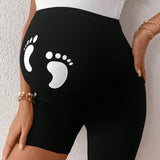 Leggings cortos y casuales de maternidad con cintura ajustable y estampado de huellas de pies de bebe