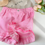 Lindo pantalon corto de mezclilla rosa de doble capa con dobladillo de volantes