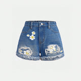 Shorts de mezclilla rasgados con bolsillo sesgado y dobladillo enrollado para chicas adolescentes de estilo boho con estampado floral para primavera / verano. Conjuntos de ropa de verano para chicas adolescentes con shorts