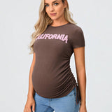 Camiseta informal ajustada de maternidad con cuello redondo de manga corta para jovenes con aberturas laterales y cordon