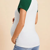 Camiseta de maternidad joven casual de cuello redondo de manga corta, ajuste regular, colorblock delgada para el embarazo