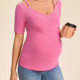 Camiseta de maternidad joven y casual con cuello en V, correa ajustable, manga corta y hueco en su diseno, ajuste regular