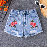 Shorts de mezclilla rasgados con dobladillo deshilachado y tendencia de verano con bordado y patrones de flores para chicas preadolescentes